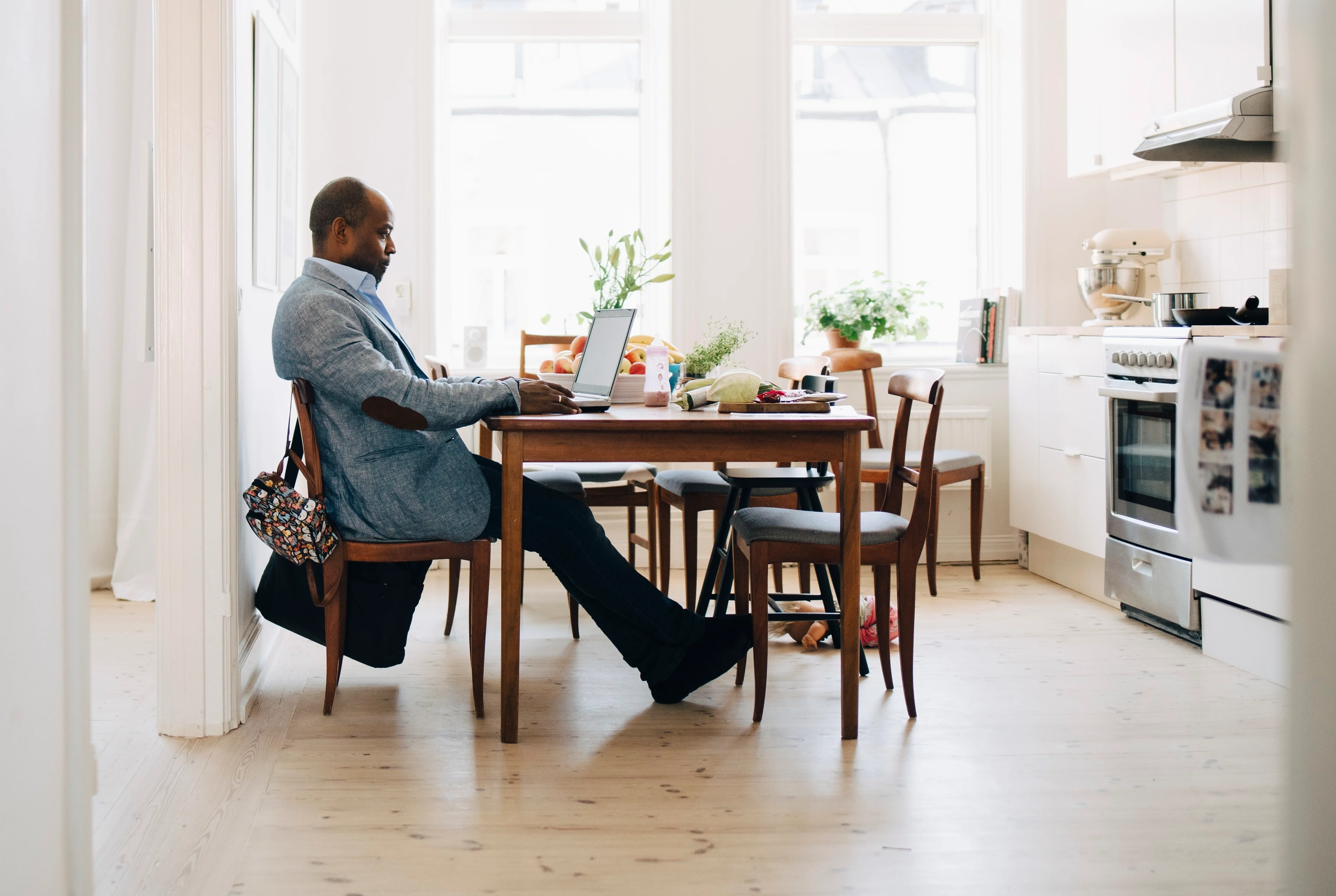 man sitting in front of laptop