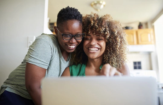 Join online image - Employee smiling whilst working