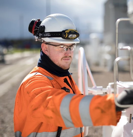 Join online image - Employee smiling whilst working