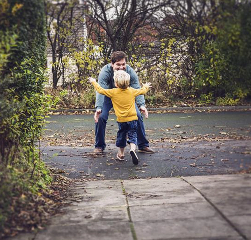 Father and son sharing a moment together, representing family financial planning